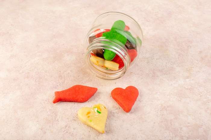 top view colorful delicious cookies different formed inside can pink surface